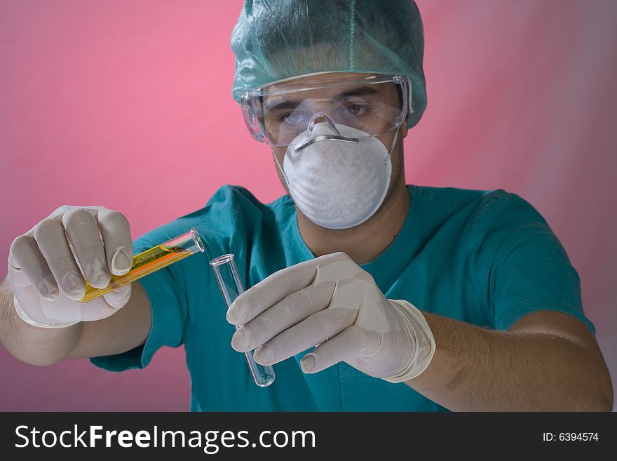 Young scientist working in a laboratory with mask. Young scientist working in a laboratory with mask