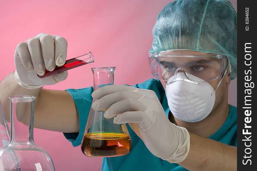 Young scientist working with mask