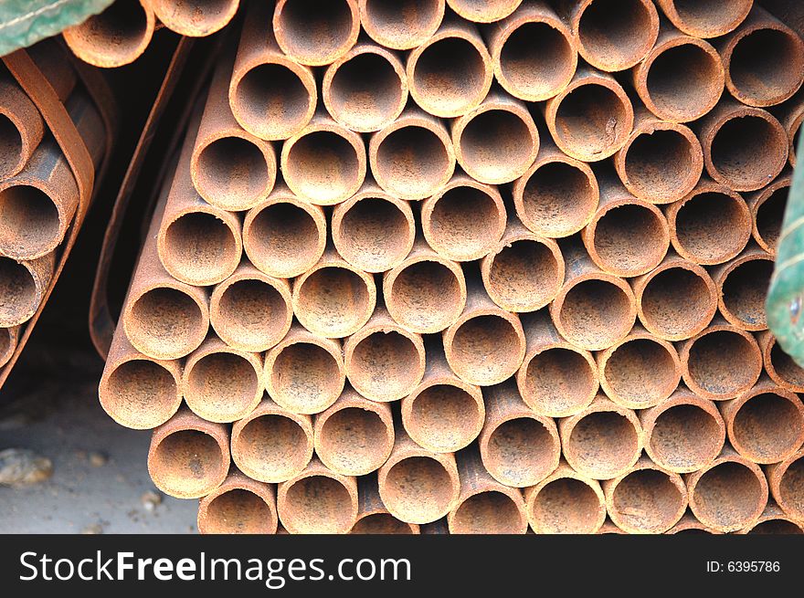 Abstract close up of a stack of steel pipes