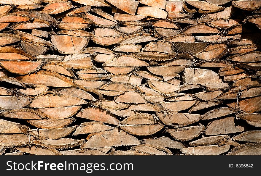 Wood logs wall showing its detailed texture. Wood logs wall showing its detailed texture