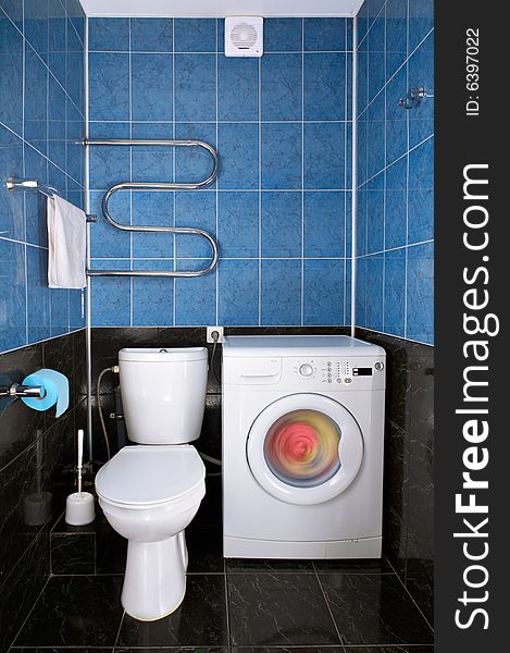 Interior of a toilet with a washing machine