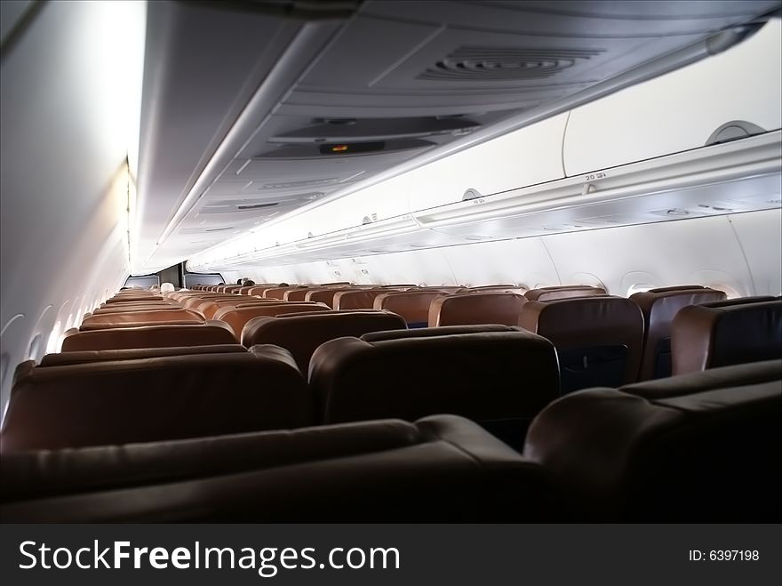 View of the main cabin on an airliner while in flight. View of the main cabin on an airliner while in flight.