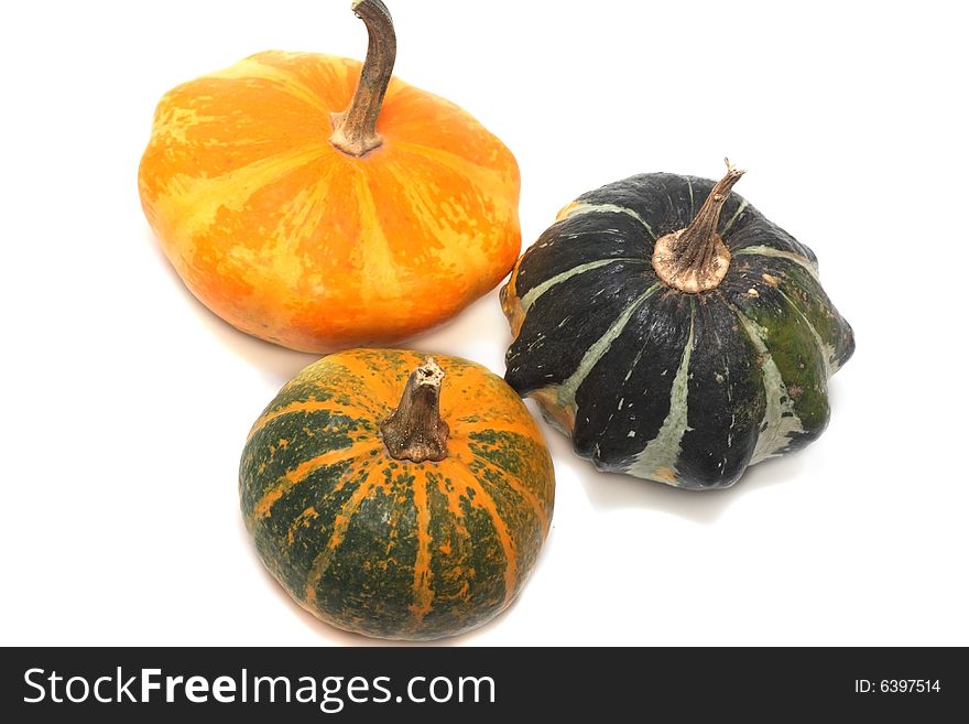 Three fancy pumpkins isolated over white