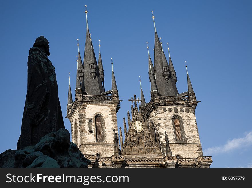 Silhouette of Jan Hus statue and St. Teyn gothic cathedral on Old Town Square in Prague. Silhouette of Jan Hus statue and St. Teyn gothic cathedral on Old Town Square in Prague.