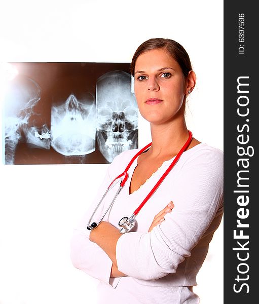 A beautiful young doctor with a red stethoscope and a xray image in the back. Isolated over white. A beautiful young doctor with a red stethoscope and a xray image in the back. Isolated over white.
