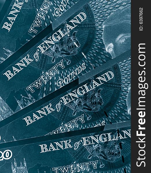 Blue toned close-up of twenty pound notes