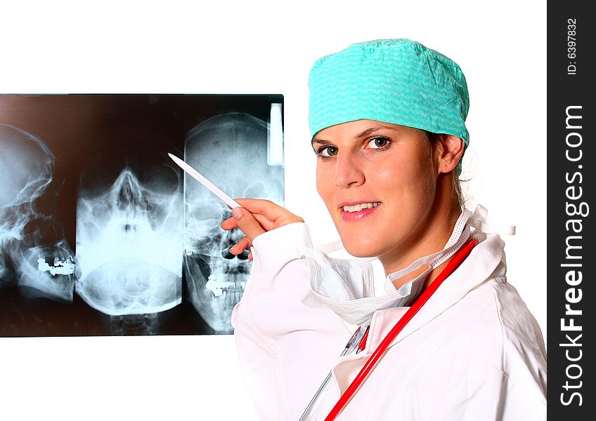 A young female medical lab worker with a x-ray in the background and a stethoscope around the neck! Isolated over white.
