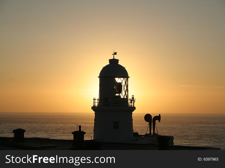 Lighthouse At Sunset