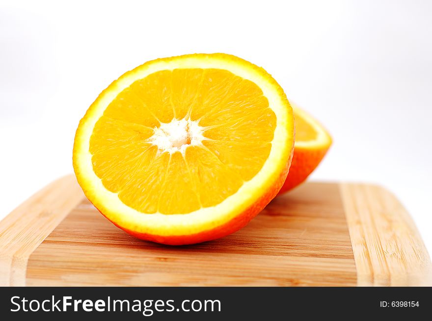 Orange on breadboard isolated on white