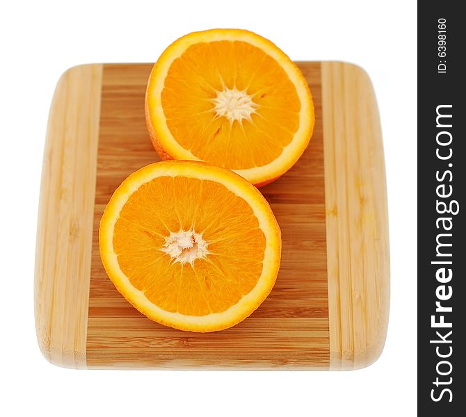 Orange on breadboard isolated on white