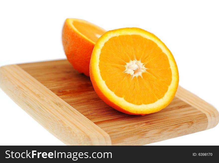 Orange on breadboard isolated on white