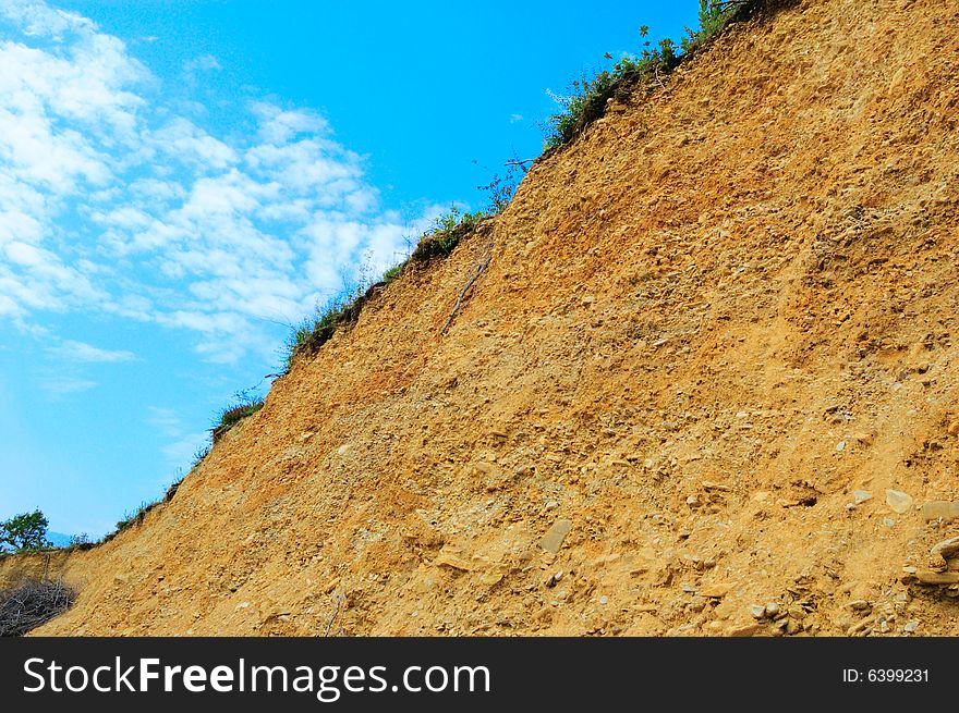 Colored yellow wall of open pit (quarry). Colored yellow wall of open pit (quarry)