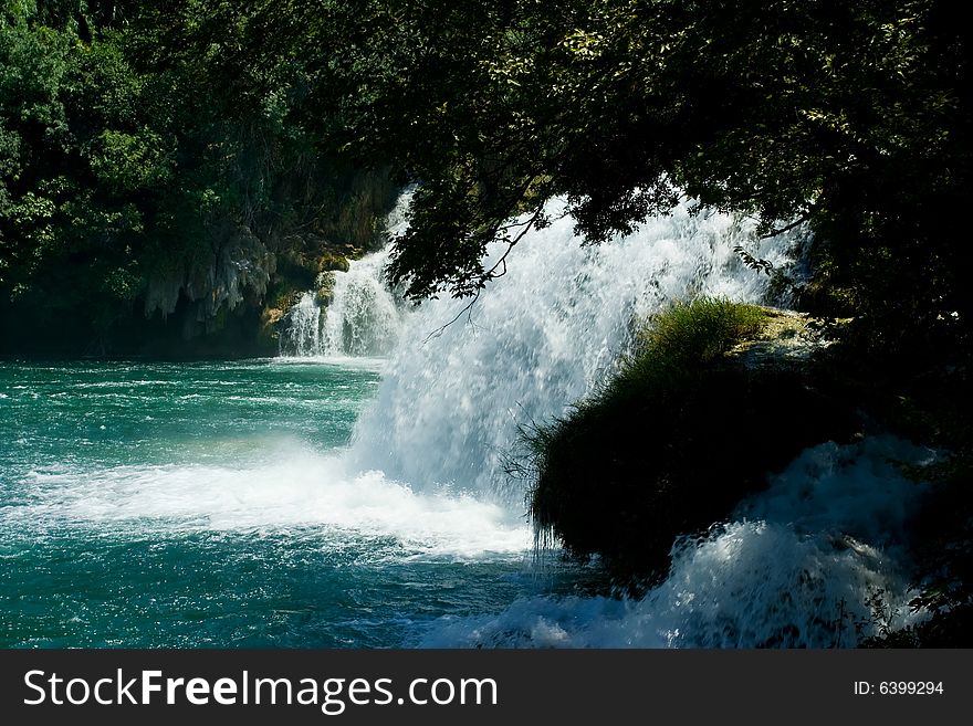 Beautiful forest waterfall during summer