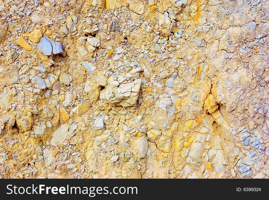 Colored rough yellow rock surface