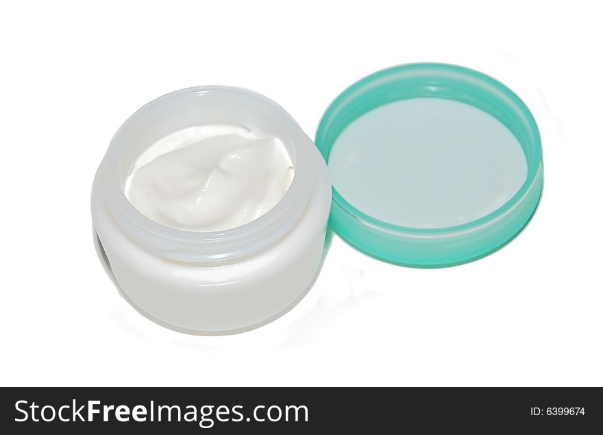 White cosmetic cream opened box isolated over white. White cosmetic cream opened box isolated over white