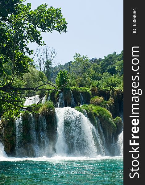 Beautiful forest waterfall during summer