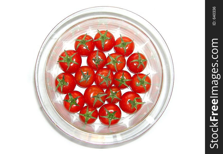 Tomatos in glass bowl. Tomatos in glass bowl