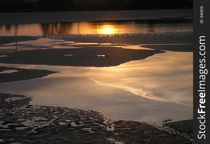 Ice breaking on the lake in the spring sunny evening. Ice breaking on the lake in the spring sunny evening