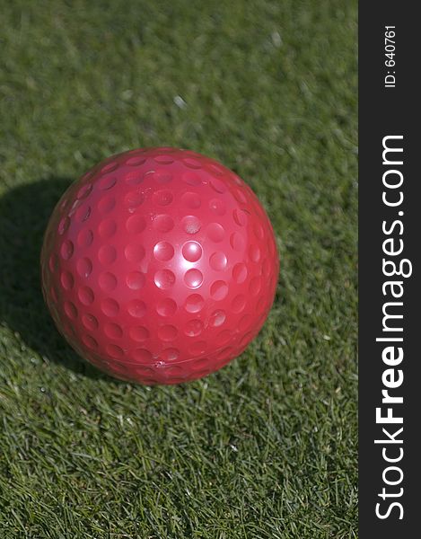 Red golf ball. Red golf ball