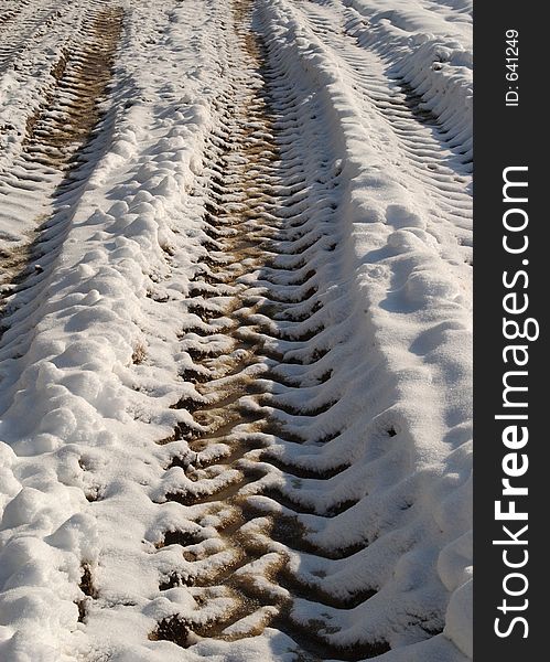 Tractor tyre tracks in the snow. Tractor tyre tracks in the snow