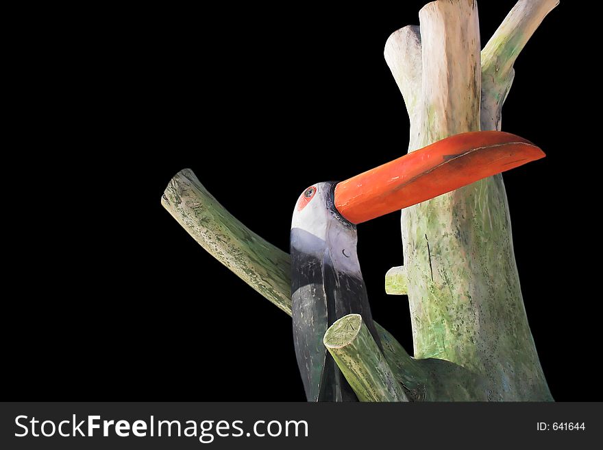 Wooden bird, isolated on black