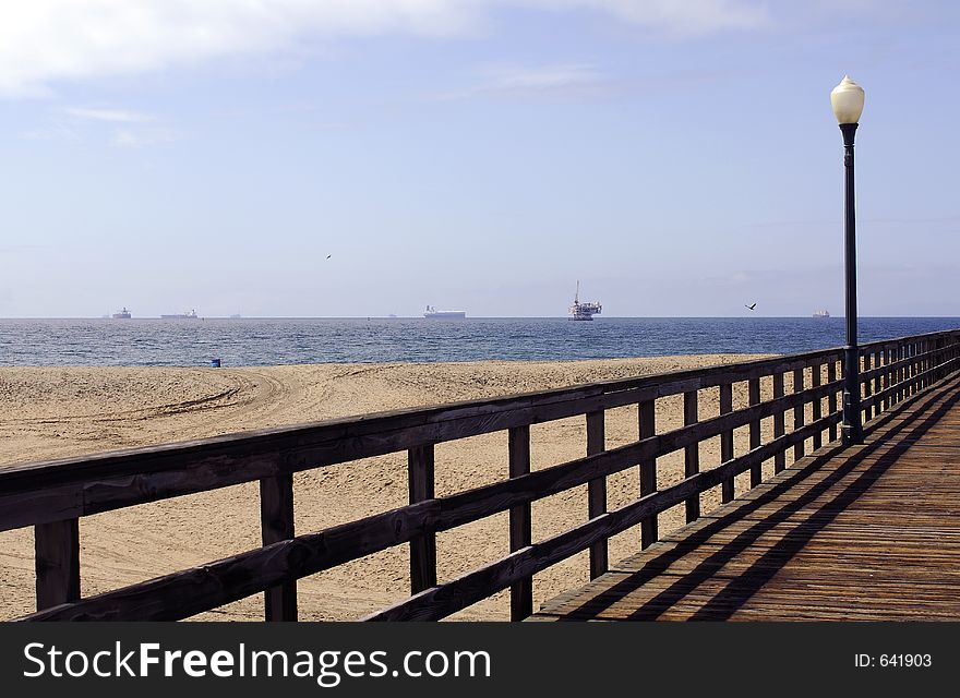 Pier With Oil Rig And Ships