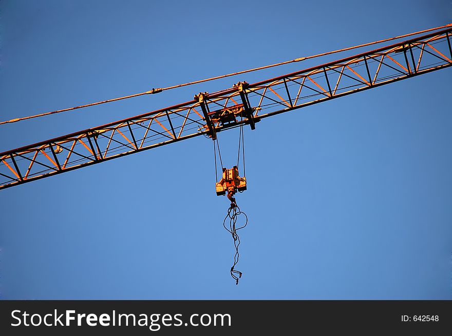 A hook and cord straps of a construction crane. A hook and cord straps of a construction crane