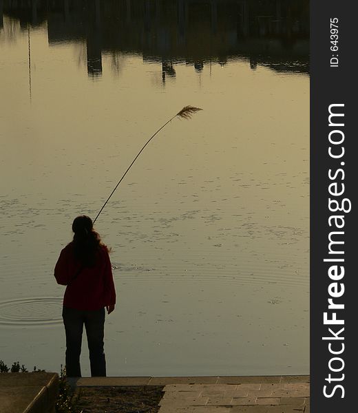 Girl Silhouette, woman with a reed on her hend