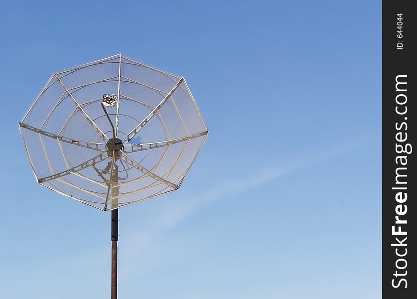 Satellite Dish against blue sky with room for text