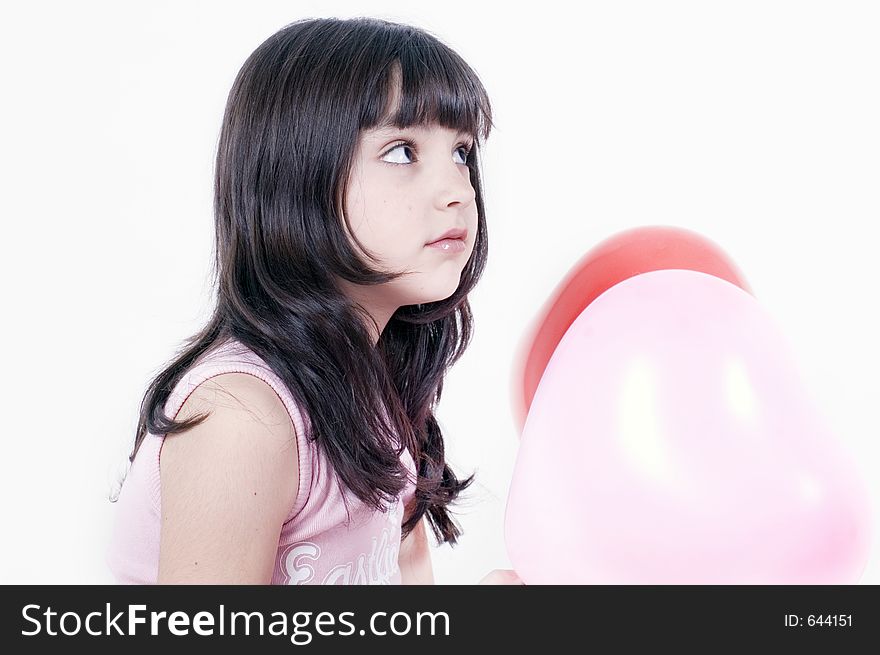 Little girl and heart shaped ballons. Little girl and heart shaped ballons