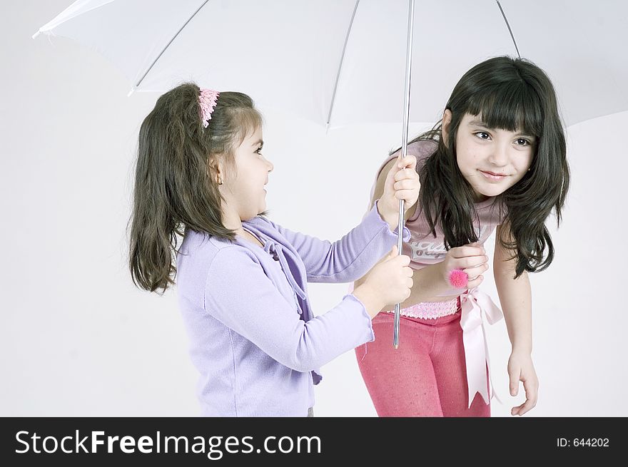 Two little girls and a white umbrella. Two little girls and a white umbrella