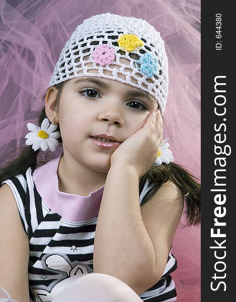 Little girl with daisies in her hair. Little girl with daisies in her hair