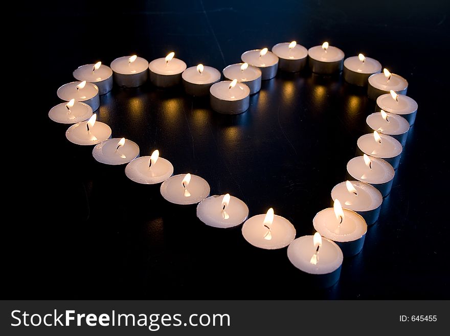 Group of Candles place in the shape of a heart. Group of Candles place in the shape of a heart