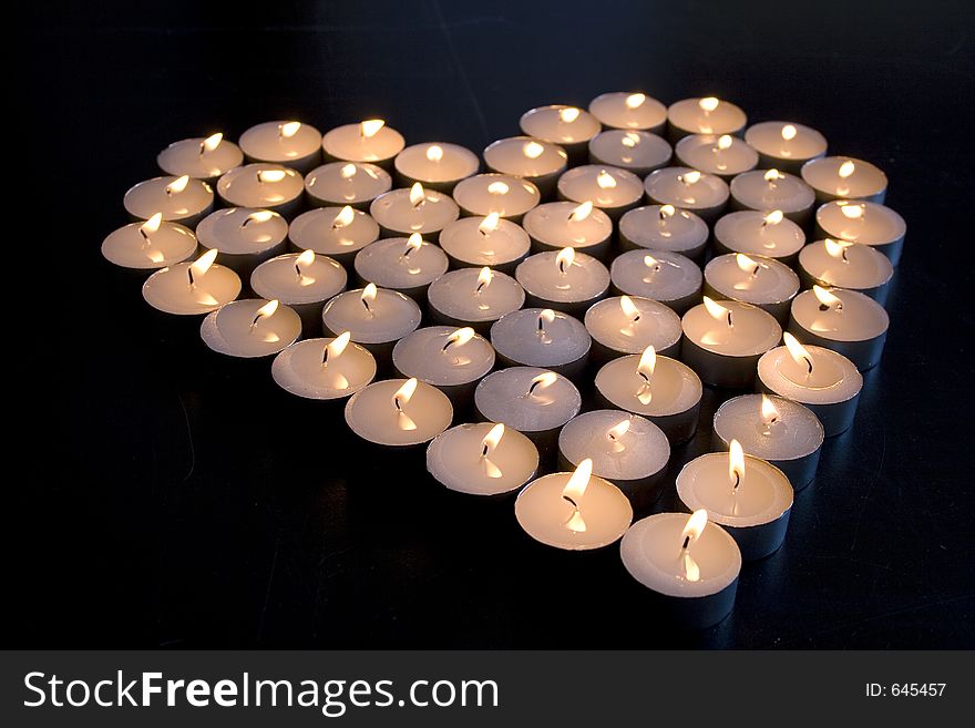Group of Candles place in the shape of a heart. Group of Candles place in the shape of a heart