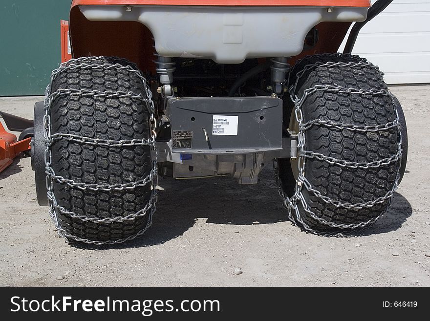 A set of chains on tractor tires. A set of chains on tractor tires