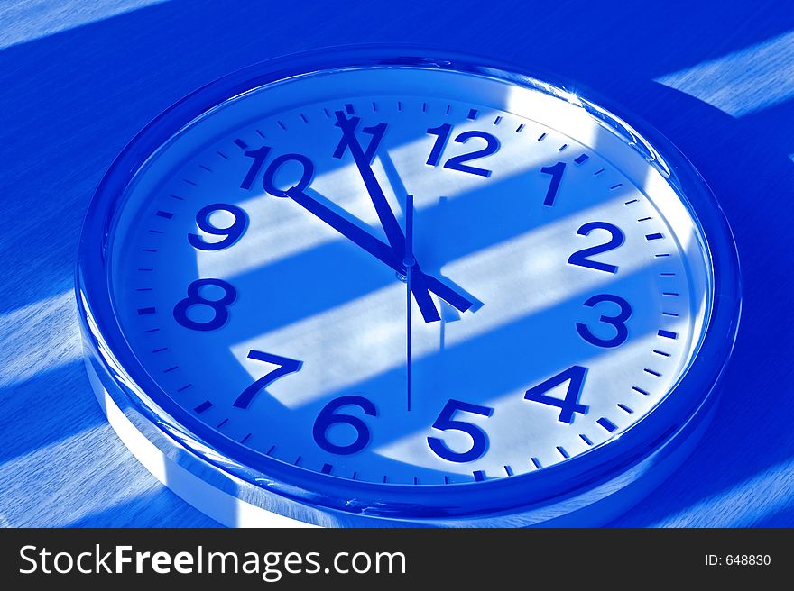 Clock in blue shadow