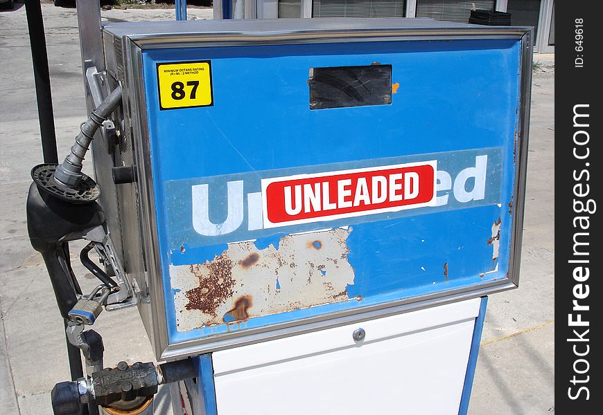 A blue and white unleaded gas pump. A blue and white unleaded gas pump