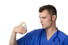 Doctor Looking At Pill Bottle Stock Image Doctor Looking At Pill Bottle Stock Image