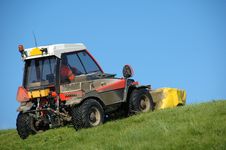 Tractor Mowing A Dike Royalty Free Stock Image Tractor Mowing A Dike Royalty Free Stock Image