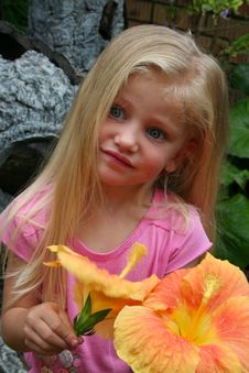 Little Girl Picking Orange Flowers Stock Images
