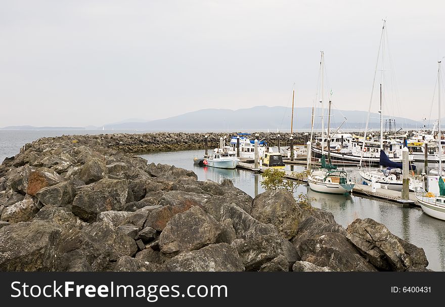 A stone sea wall around a fishing harbor. A stone sea wall around a fishing harbor