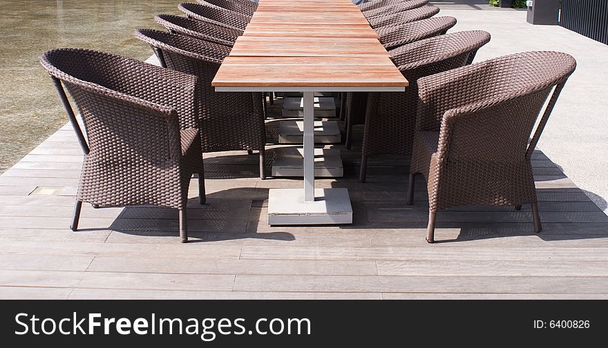 Wooden table and chairs in tropical park
