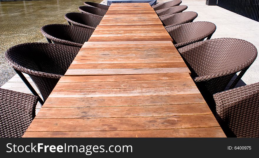 Wooden table and chairs in tropical park