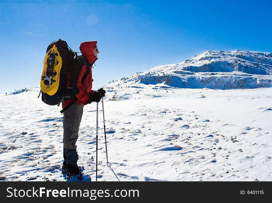 Backpacker in winter mountain, Crimea
