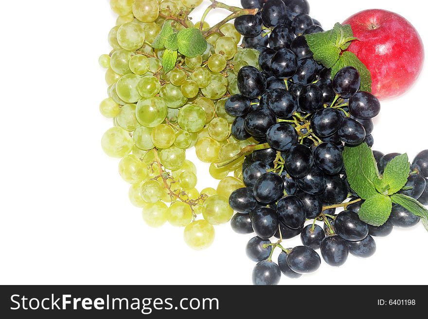 Green and red grapes and apple isolated