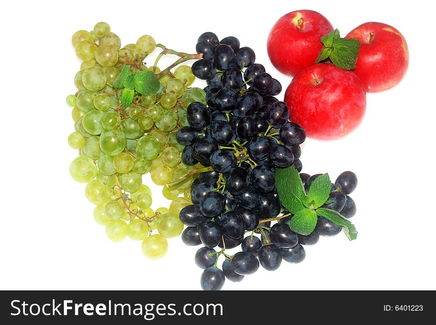 Green and red grapes and apple isolated