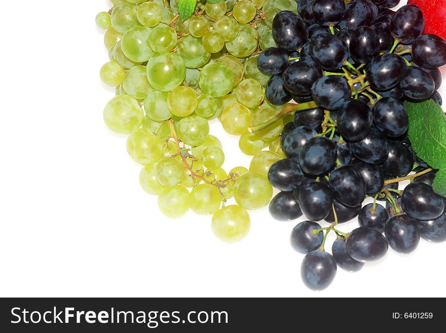 Green and red grapes and apple isolated