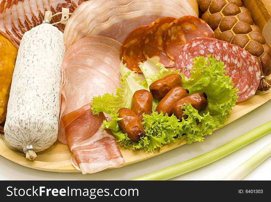 Various assortments of meat products and vegetables, close-up. Various assortments of meat products and vegetables, close-up