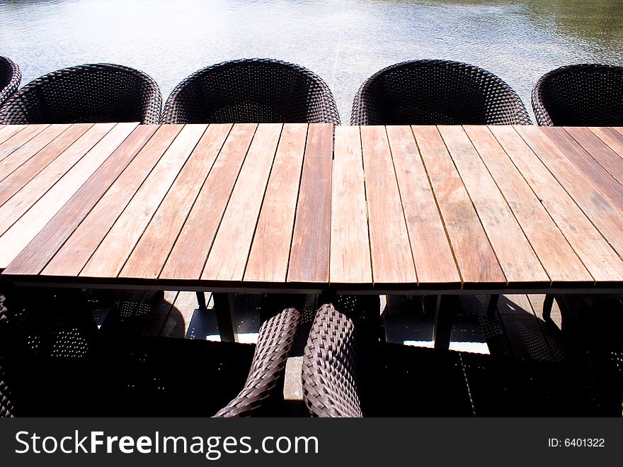 Wooden table and chairs in tropical park