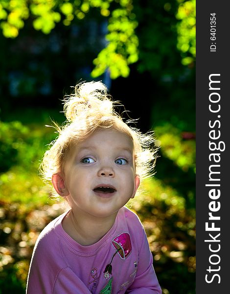 An image of little girl playing outdoor. An image of little girl playing outdoor